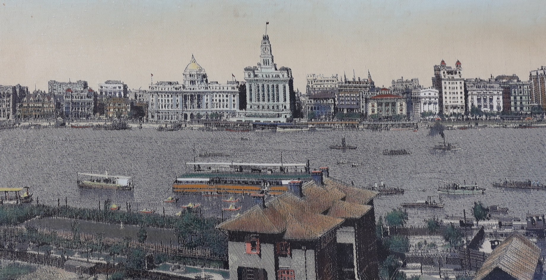 A framed early 20th century Chinese machine woven panorama of Shanghai harbour, 39x165cm excl frame